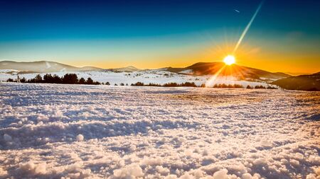 Beautiful Winter Landscape with sunsetの写真素材