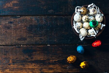 Easter eggs on wooden background with blank spaceの写真素材