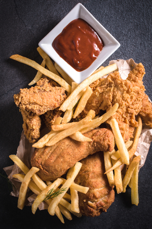 Traditional American cuisine,fried chicken meat and French friesの写真素材
