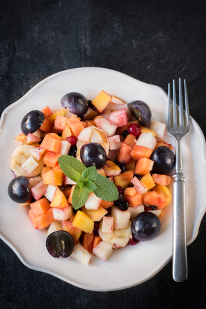 Tropical fruit salad in the plate from above,selective focus and blank spaceの写真素材