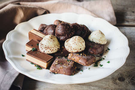Variety of chocolate tea cookies nougat pralines,selective focusの写真素材