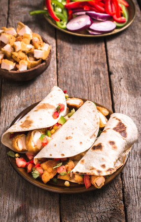 Wrap sandwiches with fried chicken meat and vegetables,selective focusの写真素材