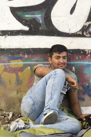 BELGRADE,SERBIA -JUNE 30, 2015: unidentified Syrian refugees, under the bridge,waithing for transport in Europian Union June 30, 2015 in Belgrade,Serbiaのeditorial素材