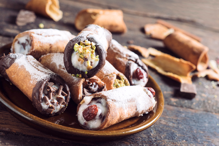 Sweet homemade cannoli stuffed with ricotta cheese cream,selective focusの写真素材