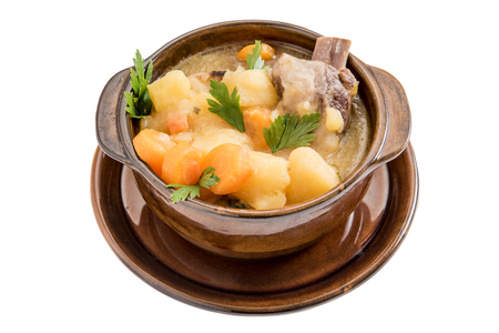 Traditional homemade stew soup with vegetables and meat isolated on white backgroundの写真素材