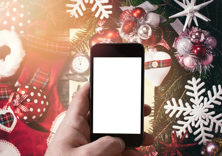 New Year decoration with blank smart phone screen in the middleの写真素材