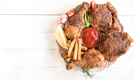 Fried chicken meat with buttermilk and french fries in plate,selective focus and blank spaceの写真素材