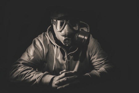 Portrait of scary man with gas mask, low key and monochromeの写真素材