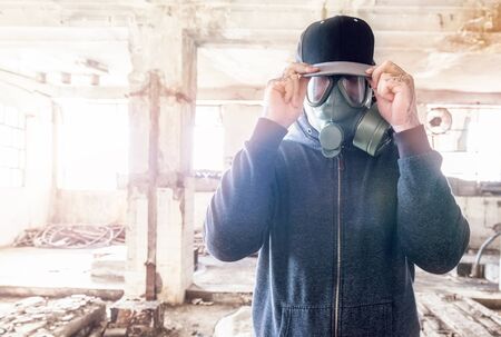 Portrait of man with gas mask and hat,selective focusの写真素材