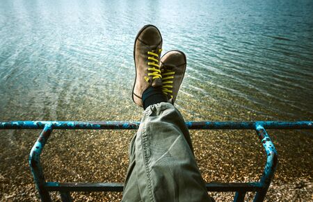 Man relaxing near by water,selective focusの写真素材
