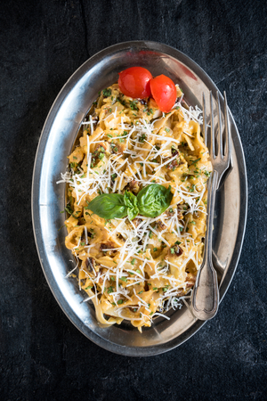 Served pasta carbonara in the metal plate,selective focusの写真素材