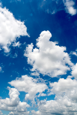 Fluffy white clouds on the blue skyの写真素材