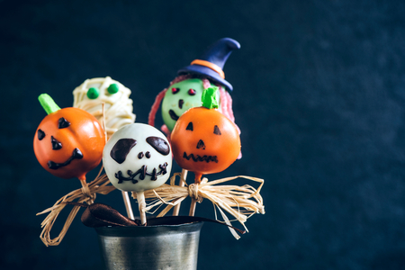 Funny delicious cake pops for Halloween on the table,selective focus and blank spaceの写真素材