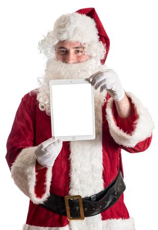 Santa holding tablet pc with blank screen,isolated on white backgroundの写真素材