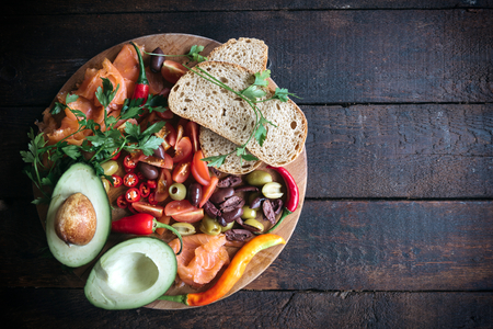 Served healthy ingredients on wooden background with blank spaceの写真素材