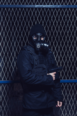 The soldier with gas mask and gun,selective focusの写真素材