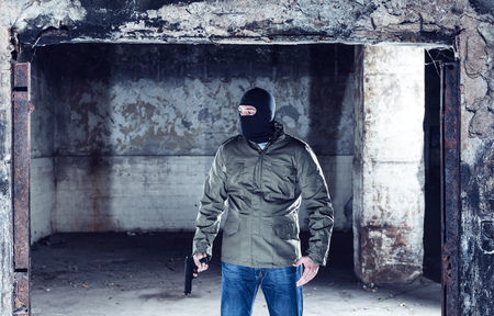 The terrorist with gun and maskの写真素材