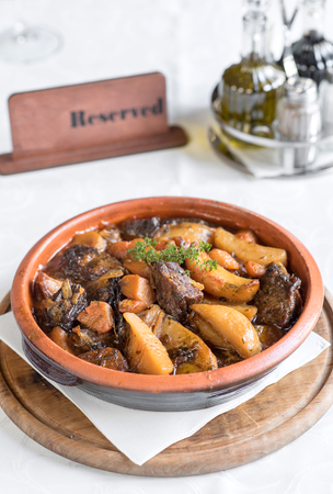 Split roasted beef and potatoes in spicy sauce,selective focusの写真素材