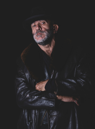 Urban man with heat portrait in low keyの写真素材