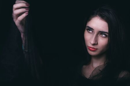 Beautiful woman portrait in low key techique,selective focusの写真素材