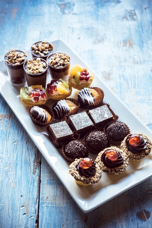 Sweet homemade mini cakes on the table,selective focusの写真素材