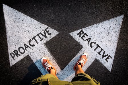 Red sheoes from above on the white arrows,dilemmas concept proactive or reactiveの写真素材