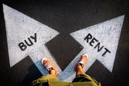 Red sheoes from above on the white arrows,dilemmas concept buy or rentの写真素材