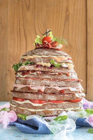 Served huge sandwich with meat and vegetables,selective focusの写真素材