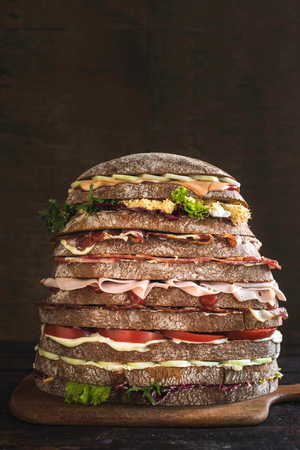 Nine layers sandwiches on wooden background,selective focusの写真素材