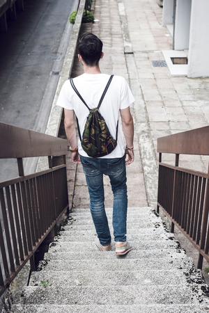 Man walking down the stairs,selective focusの写真素材