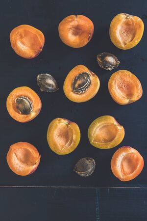 Fresh picked apricots on dark backgroundの写真素材