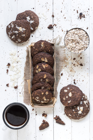 Oats and chocolate cookies  served with coffeeの写真素材