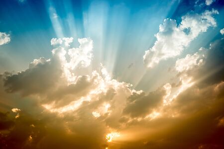 Dramatic clouds and sky with sun raysの写真素材