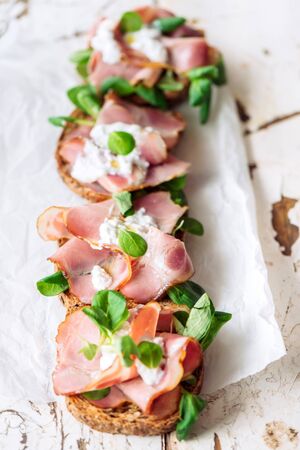 Toast sandwich with prosciutto and cream cheese,selective focus in th middleの写真素材