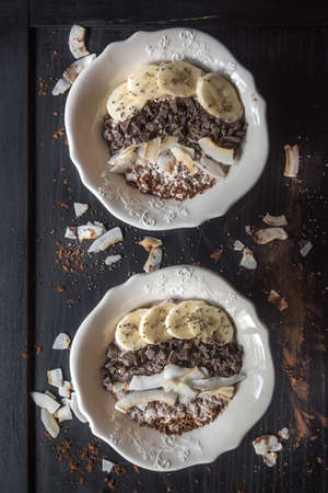 Healthy breakfast with oatmeal with many tasty ingredientsの写真素材