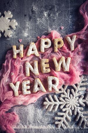 Happy New Year sign with gingerbread cookies の写真素材