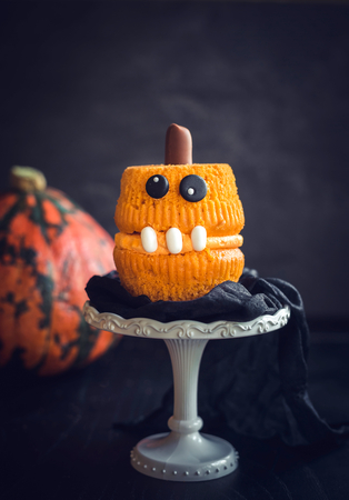 Single scary pumpkin cup cakes,selective focus  の写真素材