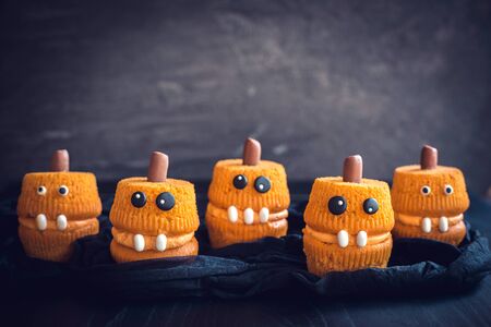 Group of scary pumpkin cup cakes の写真素材