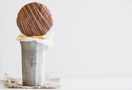 Sweet cookie with chocolate and caramel on the stick,blank spaceの写真素材