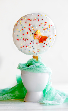 Sweet cookie on the stick in cup