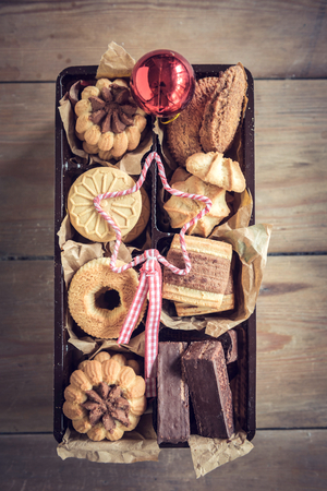Served Christmas cookies in the box on wooden backgroundの写真素材