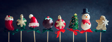 Variety of Christmas cake pops on dark backgroundの写真素材