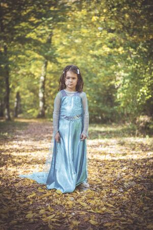 Little fashionable girl posing in the woods,selective focusの写真素材