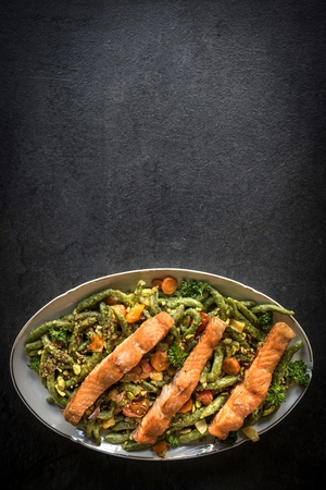 Salmon and spinach spaghetti served on the plate,blank spaceの写真素材
