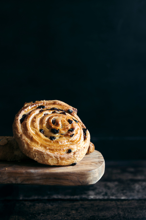 Served seet baked pastry with dried grapes,selective focus の写真素材