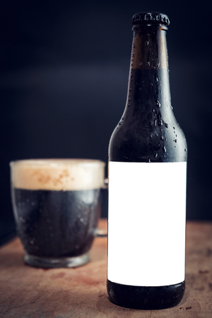 Bottle of dark beer with blank label for your adsの写真素材