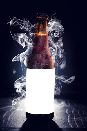 Blank label on the beer bottle with smoke effect の写真素材