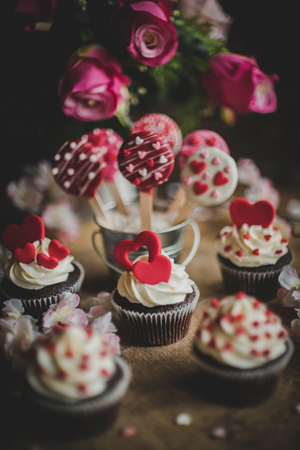 Valentine day with cup cake and cake pops on the table,selective focusの写真素材