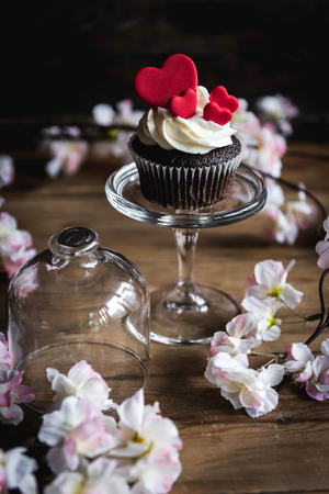 Cup cake with hearts on the top on Valentine day background,selective focusの写真素材