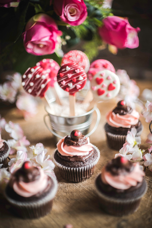 Valentine decoration with cup cakes and cake pops,selective focus の写真素材